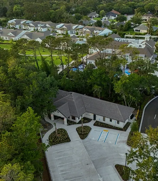 The building from above, among the trees of Sawgrass.